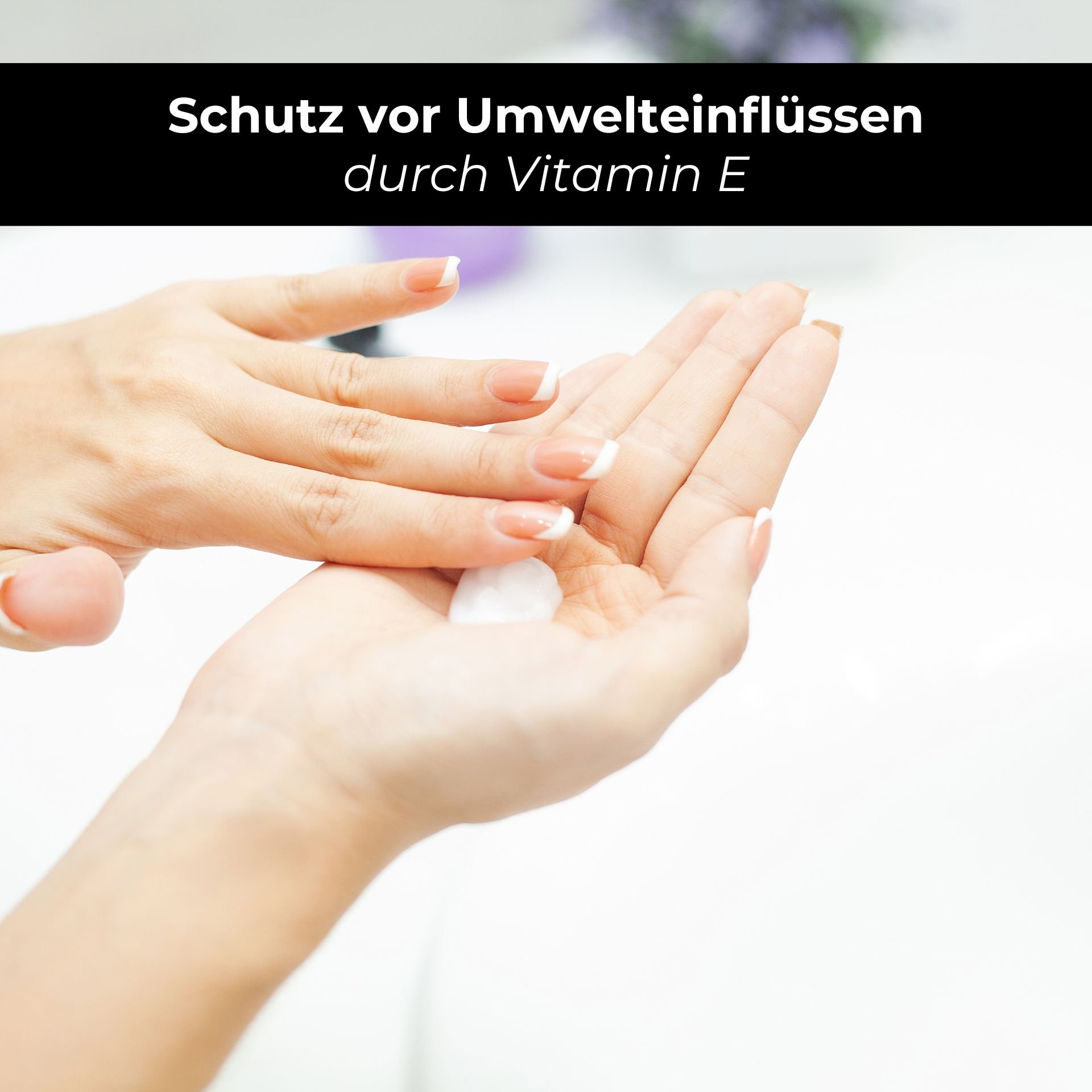 Hände, die eine feuchtigkeitsspendende Lotion auftragen, mit Fokus auf den Schutz vor Umwelteinflüssen durch Vitamin E, passend zur RAU Cosmetics Bodylotion für trockene Haut.