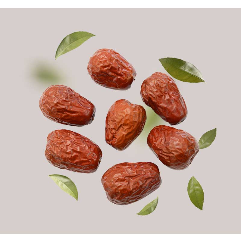 jujuba Jujuba-Früchte mit grünen Blättern repräsentieren natürliche Inhaltsstoffe in der Luxus-Hautpflege, verwandt mit dem Golden Hyaluron Gel von RAU Cosmetics für Anti-Aging und Feuchtigkeitsversorgung.